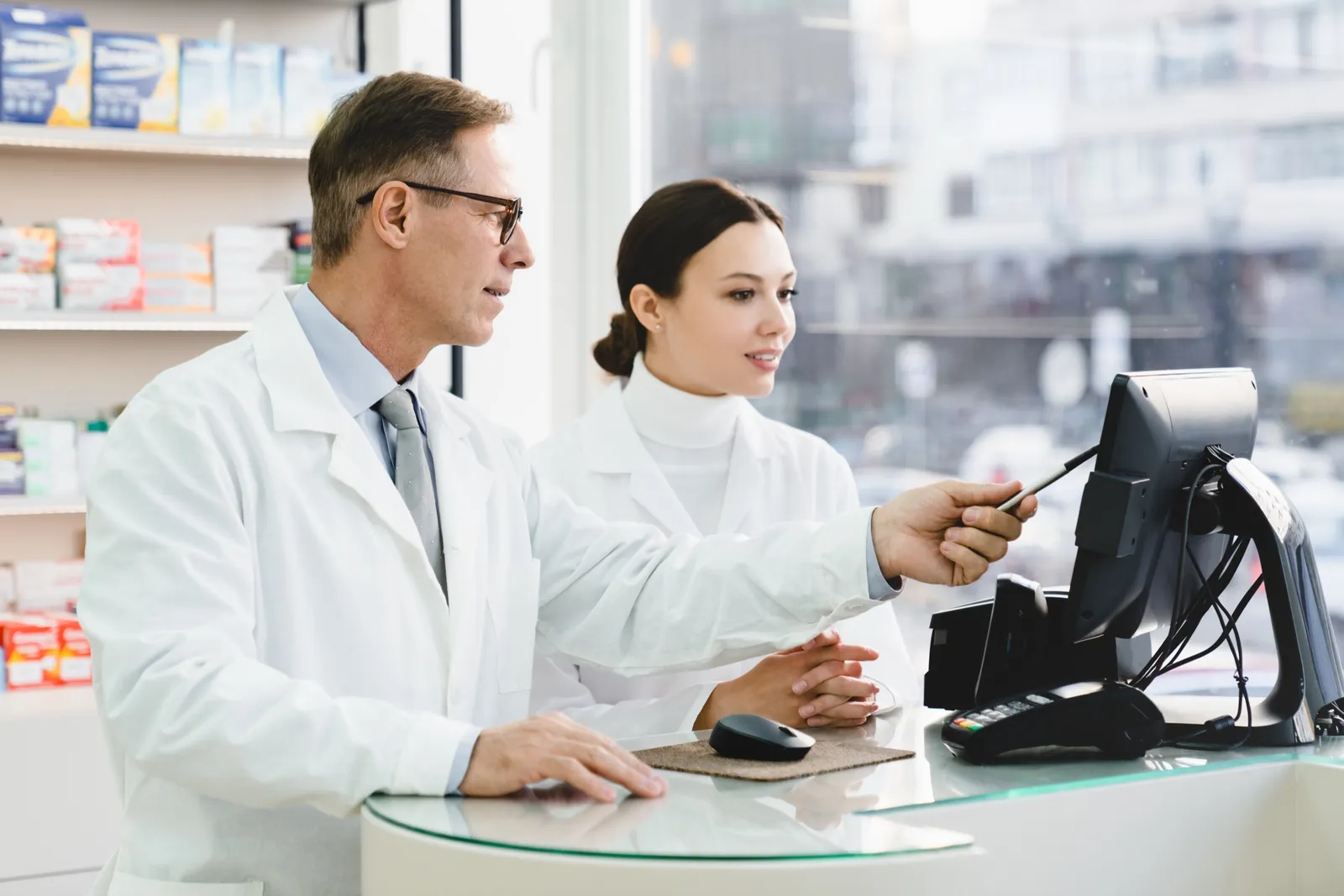 Two pharmacists reviewing a medication together